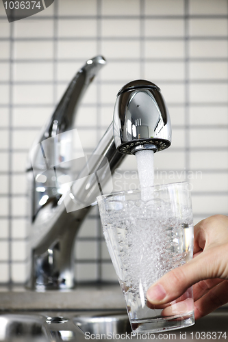 Image of Filling glass of tap water