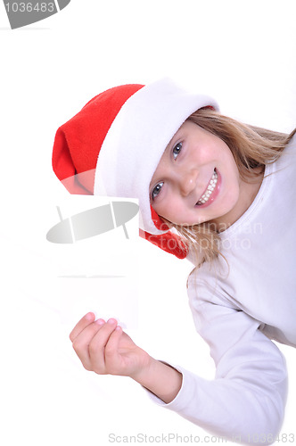 Image of cute little smiling Santa girl with a banner