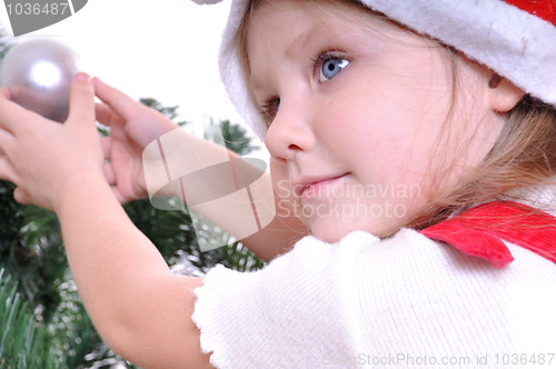 Image of little girl near Christmas tree