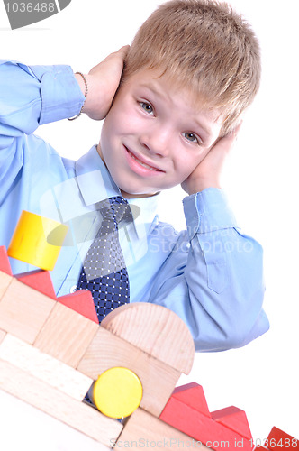 Image of schoolboy playing with bricks