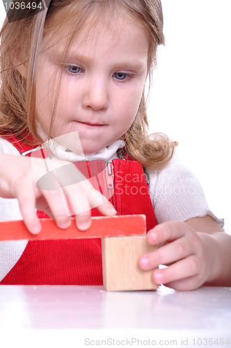 Image of kid playing with bricks