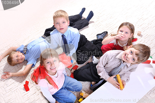 Image of children playing on the floor