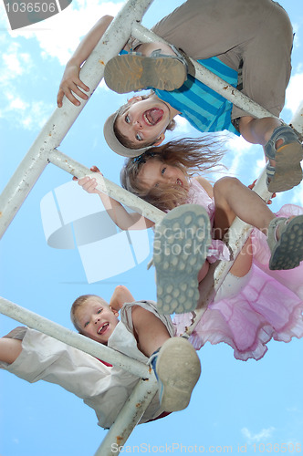 Image of happy children on jungle gym