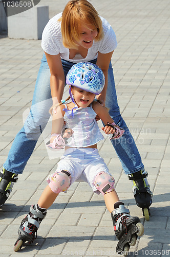 Image of family rollerblading