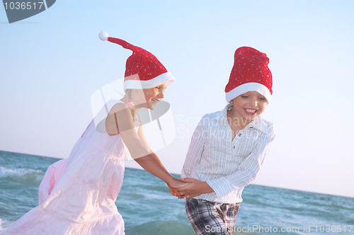 Image of Santa children on the beach