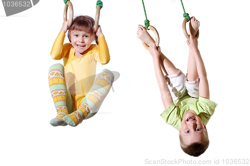 Image of children on gym rings