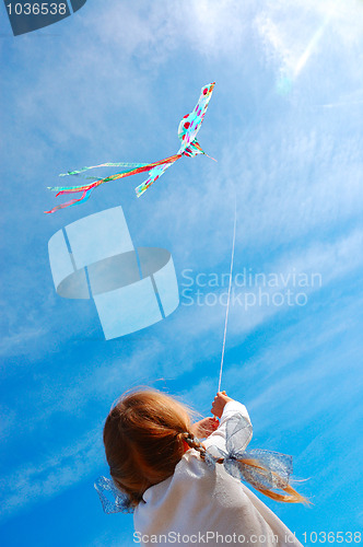 Image of child flying a kite