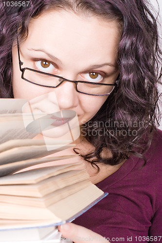 Image of woman with stack of books