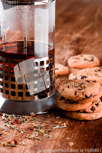Image of french press with hot tea and fresh baked cookies