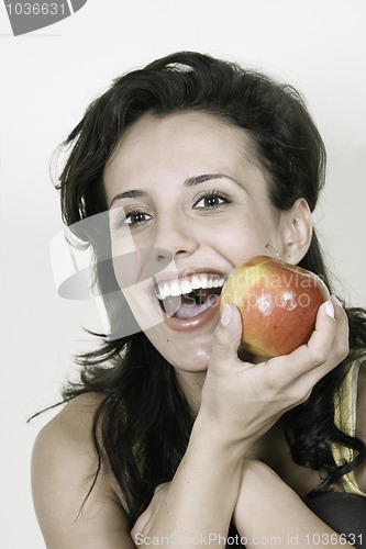 Image of Young happy smiling woman with red apple