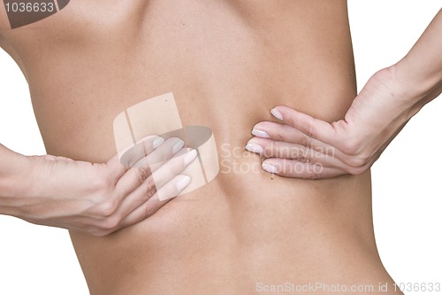 Image of Woman massaging lower back pain