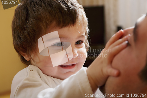 Image of Baby girl playing with dad