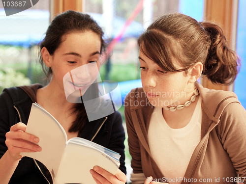 Image of Teenage girls reading a book