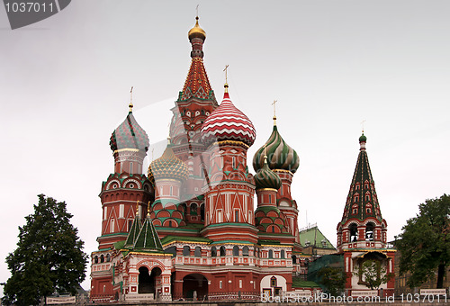 Image of Saint Basil's Cathedral in focus between two trees.