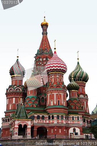 Image of The towers of Saint Basil's Cathedral isolated against a light blue morning sky.