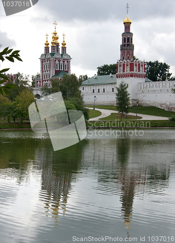 Image of Novodevichy Convent reflects in the lake - portrait style.