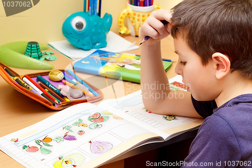 Image of boy doing homework 