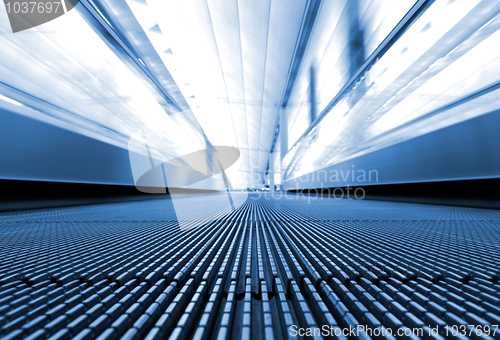 Image of moving escalator in business center