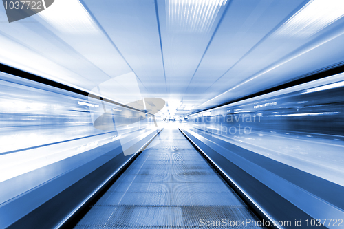 Image of moving escalator in business center