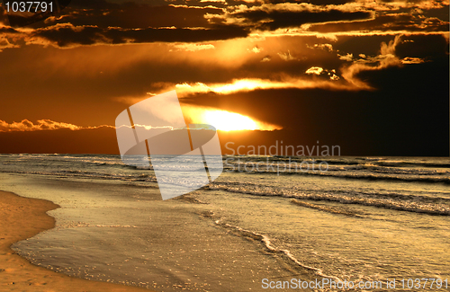 Image of Sun Breaks Through Over Beach