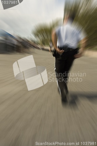 Image of policeman in action