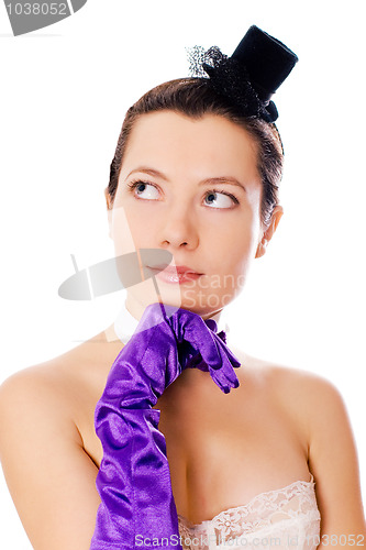 Image of woman in corset, gloves and little hat