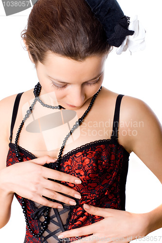 Image of young attractive woman in corset and little hat