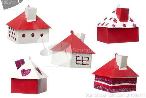 Image of Five red and white Christmas tree decorations