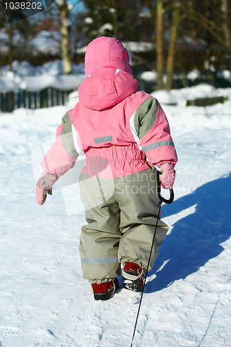 Image of Child Pulling sledges