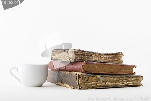 Image of Coffee cup and three old book