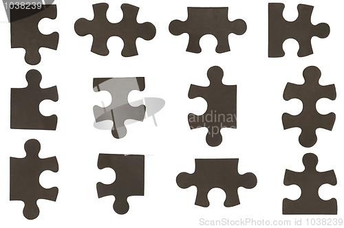 Image of different black puzzle pieces