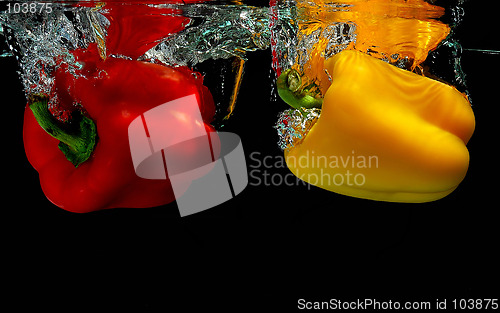 Image of Peppers falling into water