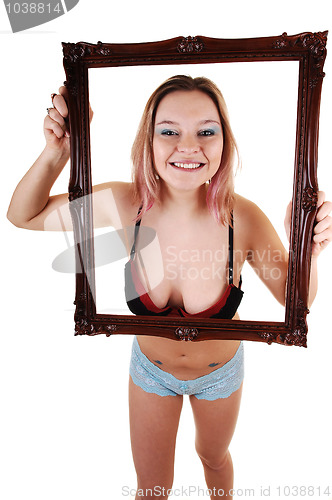 Image of Girl holding frame up.