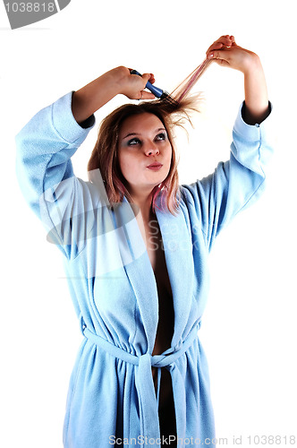 Image of Girl brushing hair.
