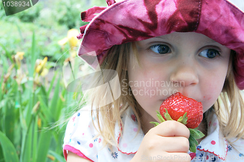 Image of eating sweet strawberry