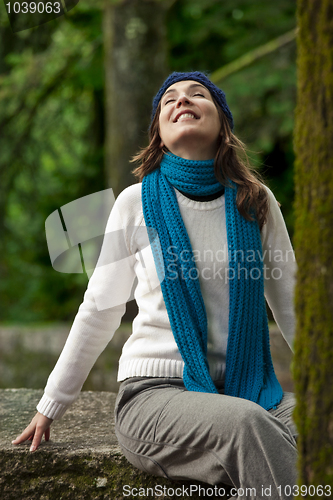 Image of Happy young woman in nature