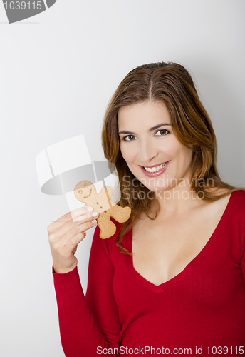 Image of Woman with a Gingerbread cookie