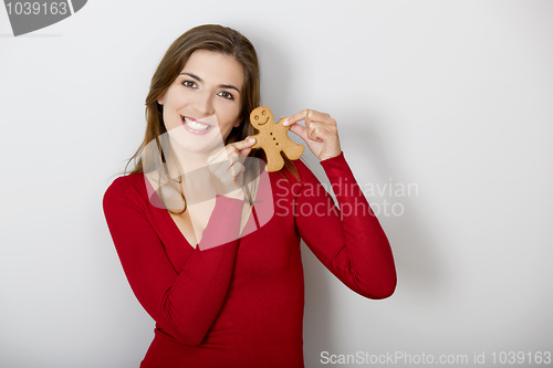 Image of Woman with a Gingerbread cookie