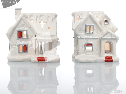 Image of Two white houses Christmas decorations