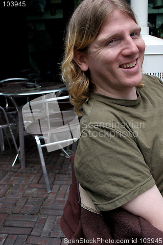 Image of Man relaxing at a cafe