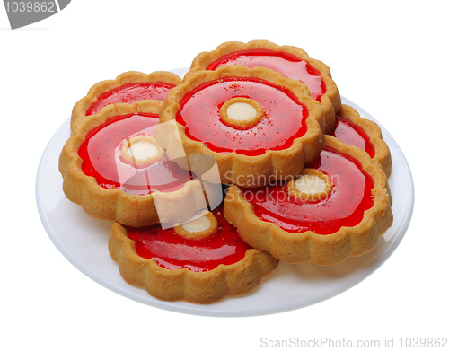 Image of Cookies with red jelly on white plate, isolated