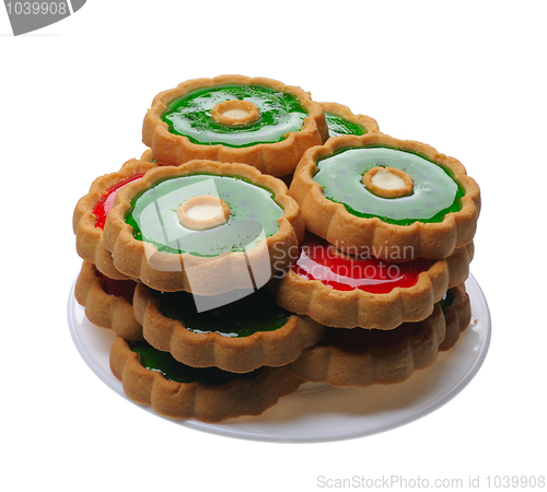 Image of Cookies with red and green jelly on white plate, isolated