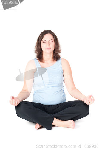 Image of Portrait of pretty pregnant woman practicing yoga