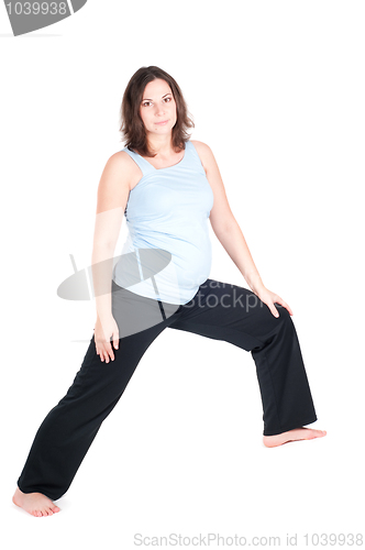 Image of Portrait of pretty pregnant woman practicing yoga