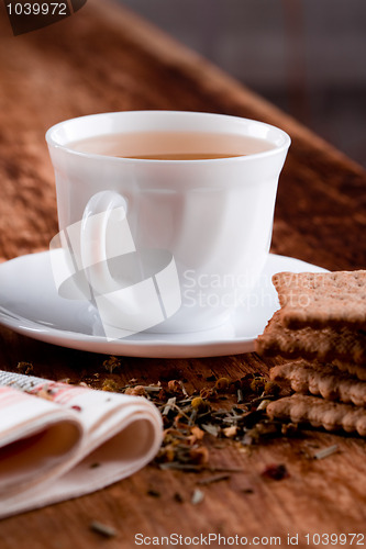 Image of cup of herbal tea and some fresh cookies 