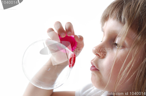 Image of child blowing bubbles