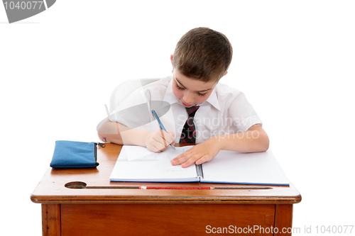 Image of Little boy doing school work or homework