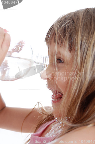 Image of thirsty child playing with water