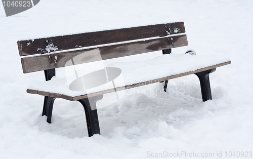 Image of Snow covered bench