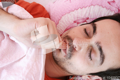 Image of Young man sleeping .